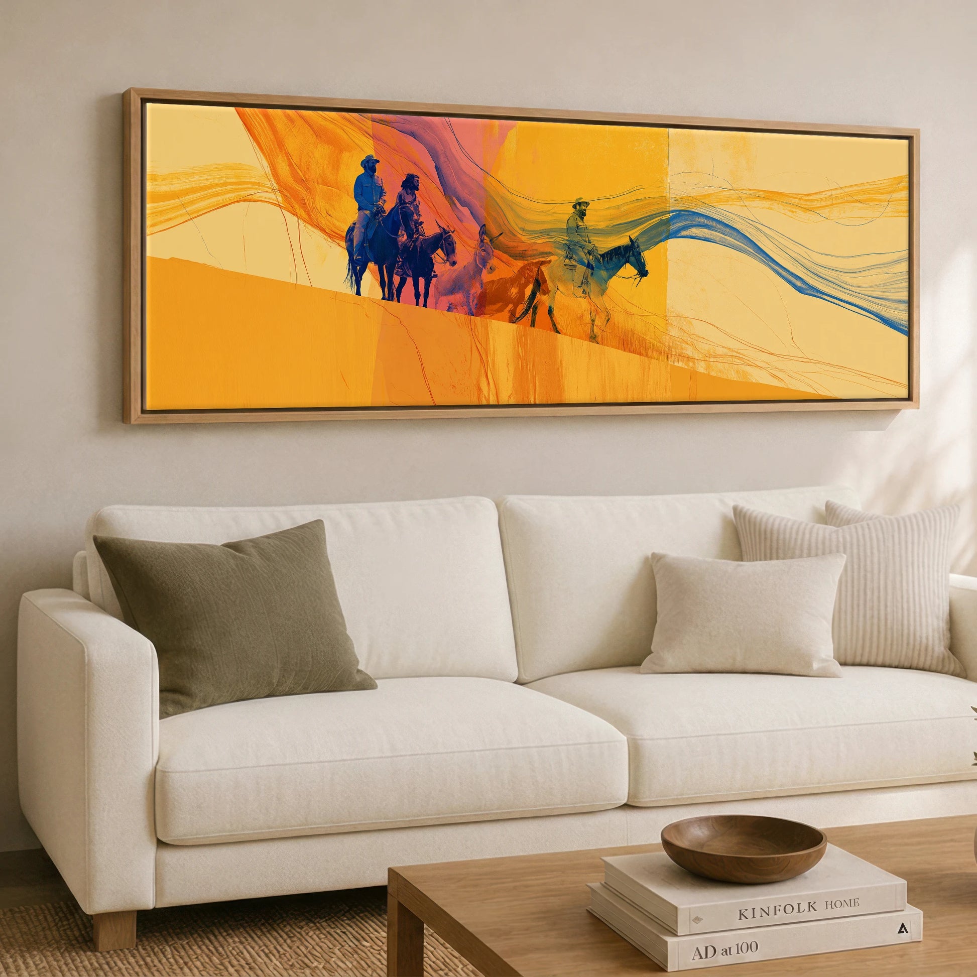 Riding the Horizon Horse & Rider panoramic canvas wall art displayed above a sofa