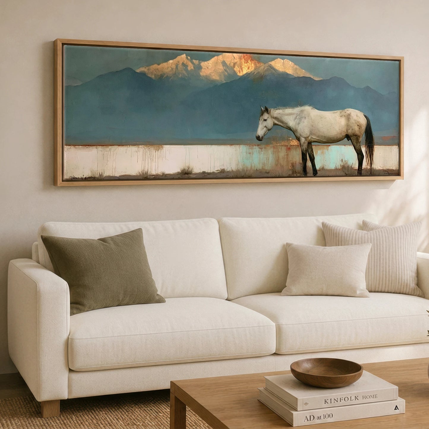 The Gilded Peak Horse Landscape panoramic canvas wall art displayed above a sofa
