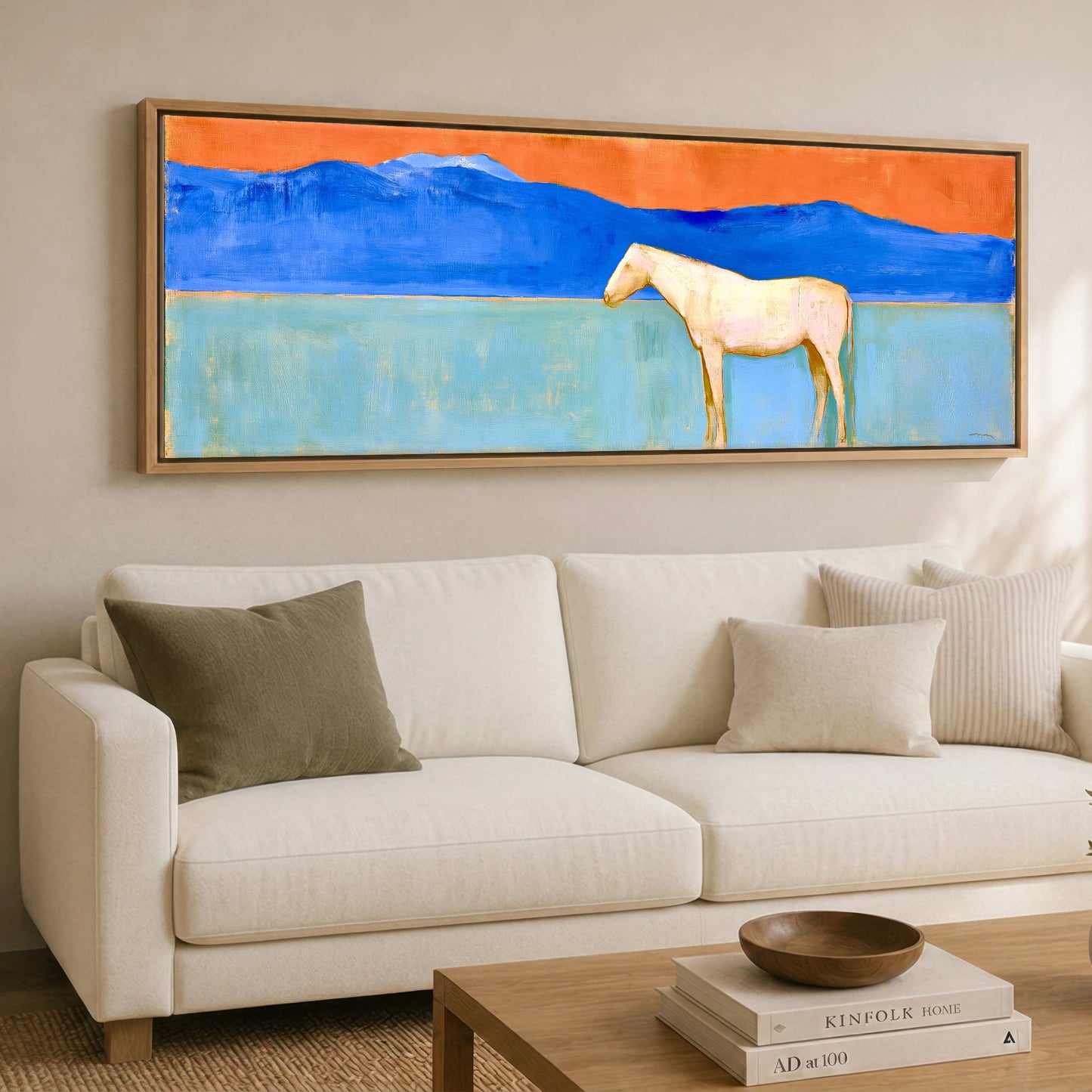 Terracotta Sky Solitude Horse Landscape panoramic canvas wall art displayed above a sofa