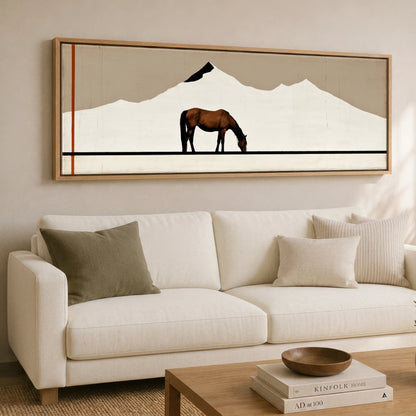 The Minimalist Pasture Horse Landscape panoramic canvas wall art displayed above a sofa