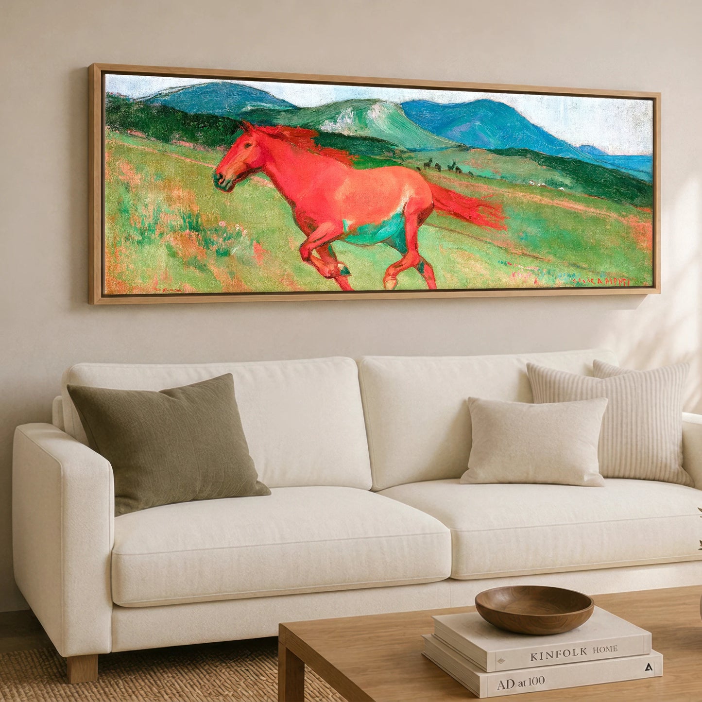 The Crimson Gallop Horse Landscape panoramic canvas wall art displayed above a sofa