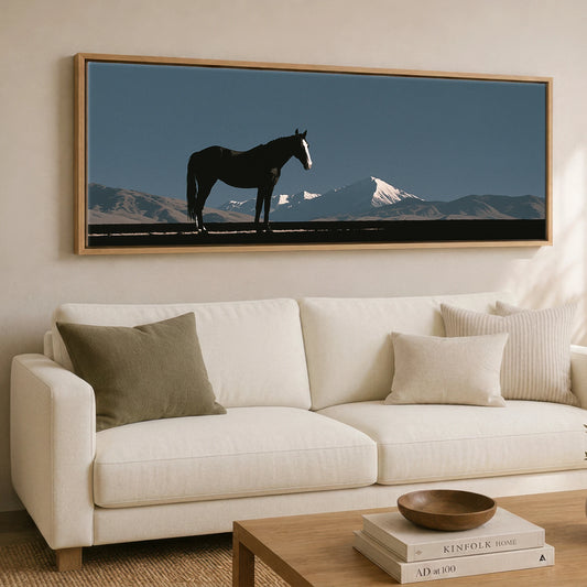 Black Horse Silhouette by Mountains Horse Landscape panoramic canvas wall art displayed above a sofa