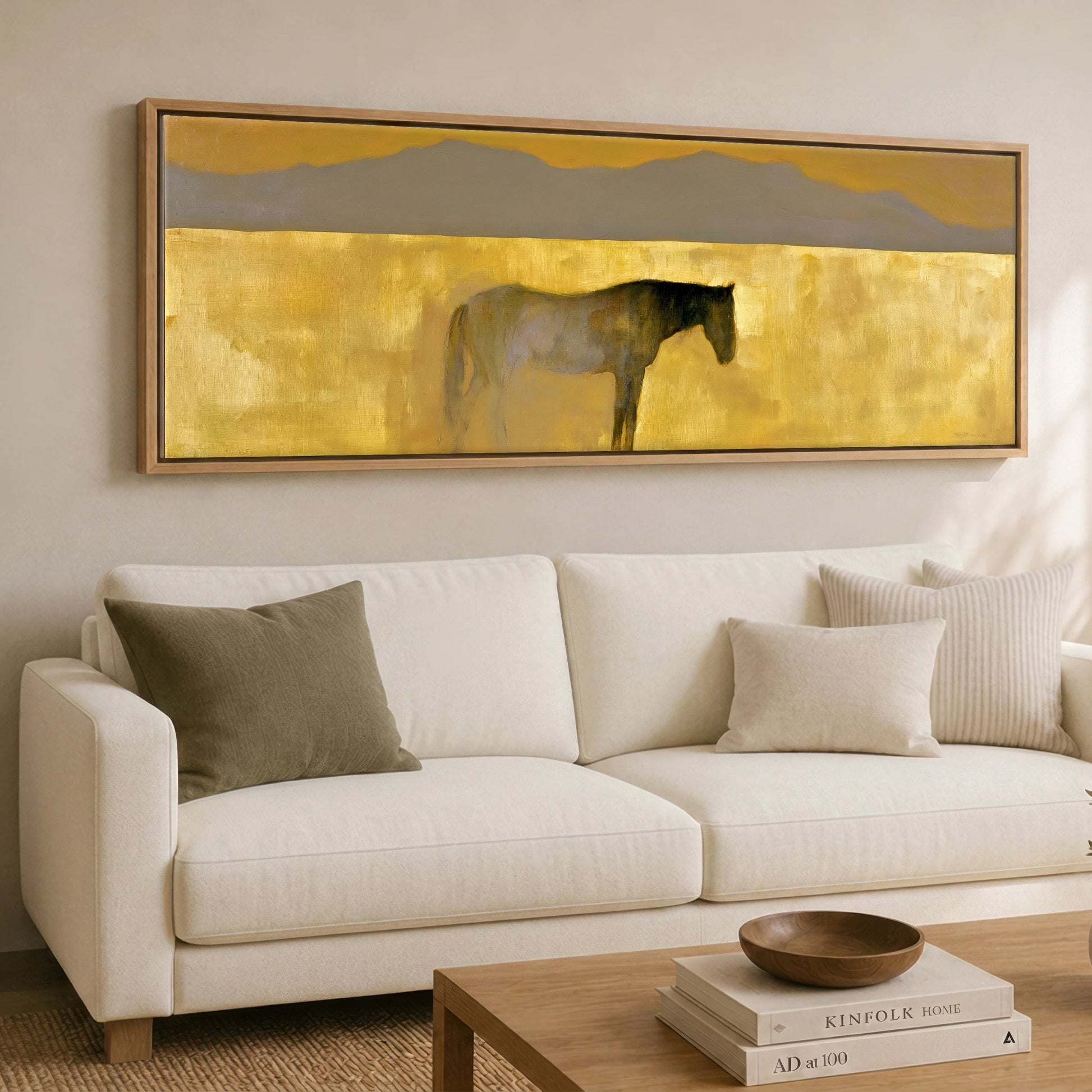 The Golden Expanse Horse Landscape panoramic canvas wall art displayed above a sofa
