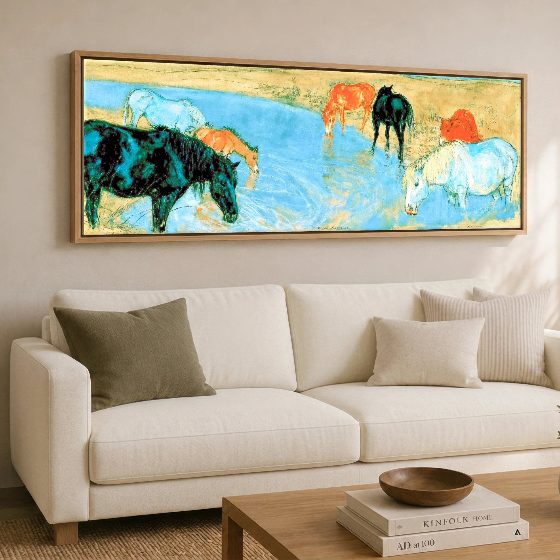 The Cerulean Stream Wild Horses panoramic canvas wall art displayed above a sofa